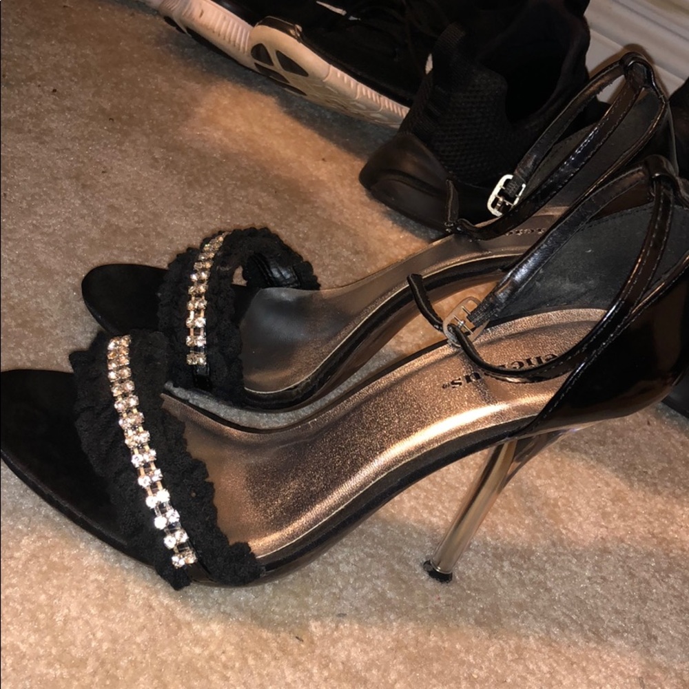 Black open-toe heels with rhinestone detailing.👠